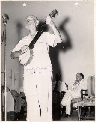 Booth Campbell of Cane Hill, Arkansas, preforming before John Gould Fletcher and others at an early meeting of the Arkansas Folklore Society, ca. 1949 (PC3624). 